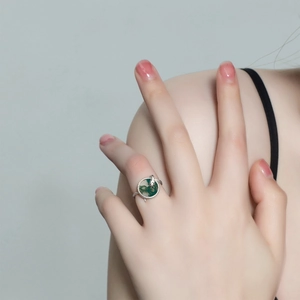 Snake ring in S925 sterling silver with black onyx and green diamond embellishments