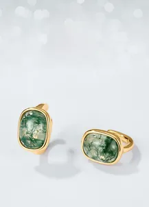 Close-up of green moss agate earrings with unique natural textures in gold settings
