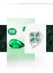 Macro detail of silver clover ring featuring pear-cut emerald stones and pavé set diamonds