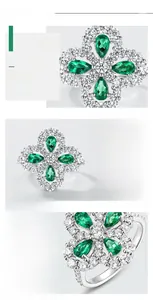 Macro shot of S925 silver clover ring with teardrop lab-grown emeralds and diamonds