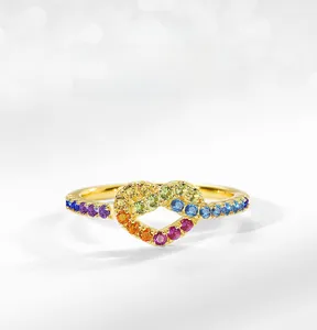 Macro shot of S925 silver infinity heart ring featuring colorful rainbow zircon stones