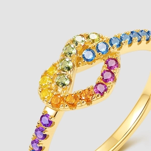 Rainbow heart ring with colorful zircon in gold plating for women on light gray background