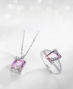 Macro shot of rectangular ametrine gemstone set in silver ring with hollow-out diamond band