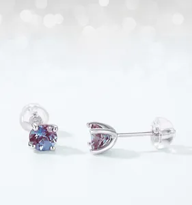 Close-up of four-prong set round alexandrite stud earrings in S925 sterling silver