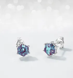 Macro detail of S925 silver stud earrings with hexagonal alexandrite in six-prong setting