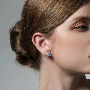 Minimalist S925 sterling silver alexandrite stud earrings worn on female ear
