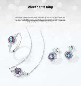 Macro shot of silver jewelry set with alexandrite stones and opal beads on grey background