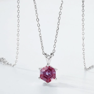 Macro detail of hexagonal alexandrite pendant with six-prong setting on S925 silver chain