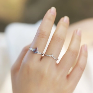 Macro detail of S925 silver ring set with kite-cut alexandrite on model finger