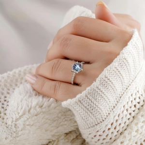 Hexagon cut alexandrite ring in S925 sterling silver worn with warm knitwear