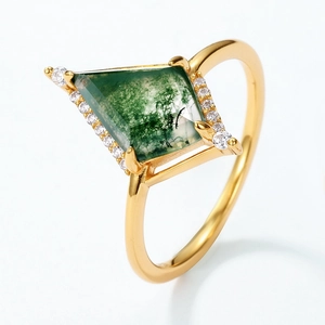Kite-cut natural moss agate ring in gold finish with side zircon accents on white background