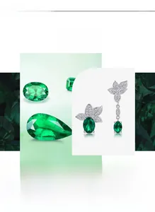 Macro view of asymmetrical leaf earrings with green emerald gems and white zircon inlay