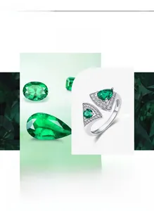 Detail showing fan-shaped emerald stone setting with micro-paved white zircons on silver ring