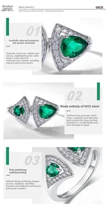 Detail of fan-shaped silver ring with emerald stone and brilliant micro-inlay finish