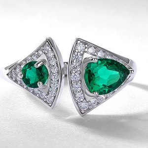 Elegant S925 silver fan-shaped open ring featuring twin lab-grown emerald gemstones