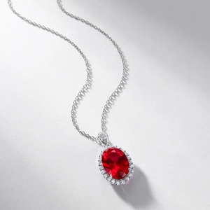 Luxurious S925 silver necklace featuring a large oval red ruby pendant with halo design