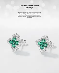 Macro detail of S925 silver four-leaf clover stud earring with lab emerald and white zircon