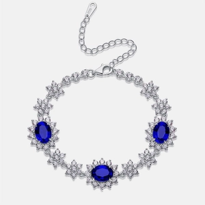 S925 sterling silver chain bracelet with oval blue gemstones and snowflake accents