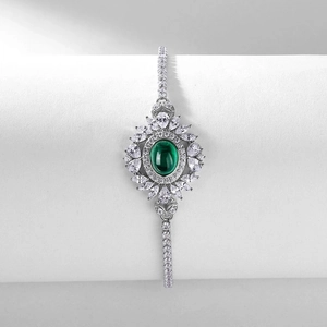 Luxurious S925 silver bracelet with emerald-cut green stone and sunflower zircon accents