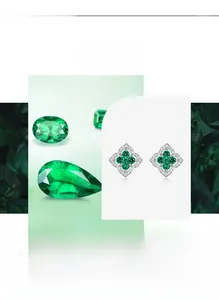 Macro detail of silver four-leaf clover stud earrings with lab-grown emerald gemstones
