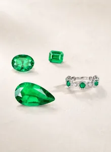 Detailed close-up of S925 silver ring with emerald-green stones and white zircon accents