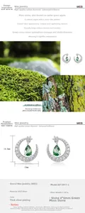 Detail of moon-shaped S925 silver earrings with green moss agate and sparkling stones