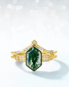 Macro detail of hexagonal moss agate ring with gold band and sparkling diamond accents