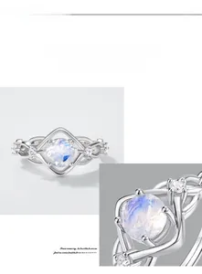 Macro detail of S925 silver ring featuring blue moonstone and pavé set zircons