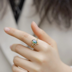 S925 gold-plated ring set with hexagonal moss agate and accent diamonds on a finger