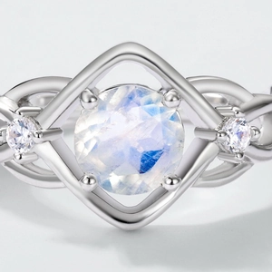 S925 silver moonstone ring featuring a twisted band and blue gemstone in diamond frame