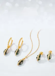 Macro shot of teardrop moss agate jewelry set in gold plated S925 sterling silver