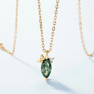 Natural moss agate teardrop pendant on gold chain necklace with a dainty bow accent