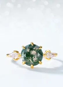 Detail of moss agate ring with gold plated 925 silver and diamond-shaped zircons