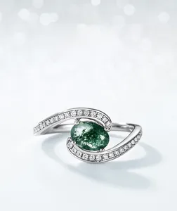 Detail of S925 silver ring featuring moss agate and side-set sparkling zircons