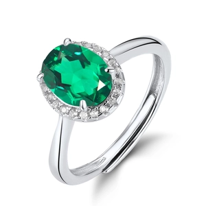 Retro S925 silver ring with oval emerald gemstone and adjustable band on white background