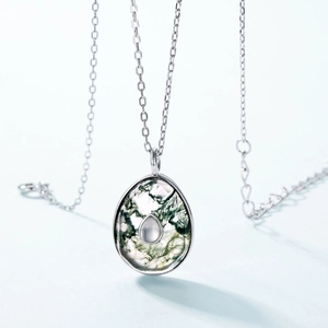 S925 silver necklace featuring a drop-shaped natural green moss agate pendant on blue background