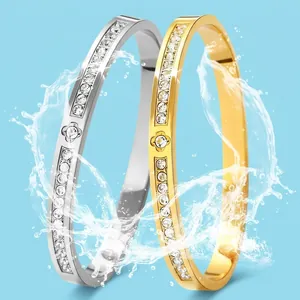 Titanium steel bangles with rhinestones in gold and silver finish showing waterproof feature