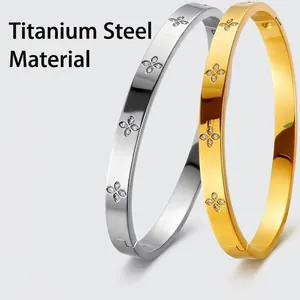 Titanium steel clover bangles set in gold and silver finish with zircon inlays