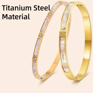 Elegant 18K gold plated stainless steel bangles with white shell inlay and zircon crystals