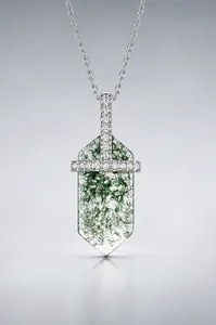 Detailed view of moss agate pendant with S925 silver frame and cubic zirconia stones