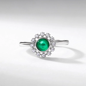 Luxurious S925 silver ring featuring an oval green emerald and zircon star halo
