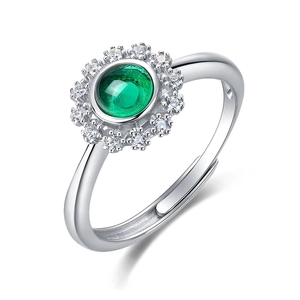 Polished S925 silver ring featuring a round green emerald cabochon in sunflower halo design