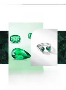 Macro detail of S925 silver ring featuring dual emerald gemstones and micro-pave zircons
