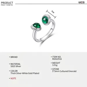 Macro detail of S925 silver ring featuring dual 5mm lab-grown emerald stones