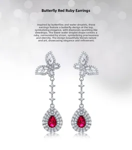 Gros plan de boucles d'oreilles papillon en argent avec rubis rouge et zircons pavés