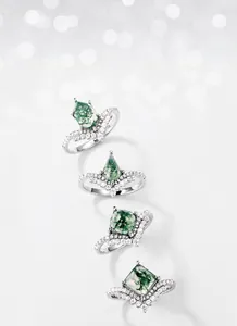 Detailed set of moss agate rings in kite and hexagon cuts with silver pavé bands