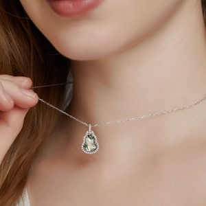 Natural green moss agate gourd pendant necklace in S925 silver on a female model