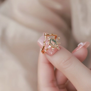 Detailed close-up of S925 silver moss agate ring set with hexagonal stone and rose gold finish