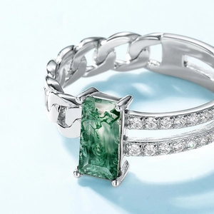 S925 silver chain ring with geometric moss agate and micro-pave crystals on blue background