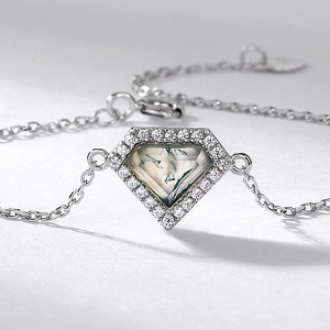 Elegant S925 silver bracelet featuring a pentagon moss agate pendant with halo crystals